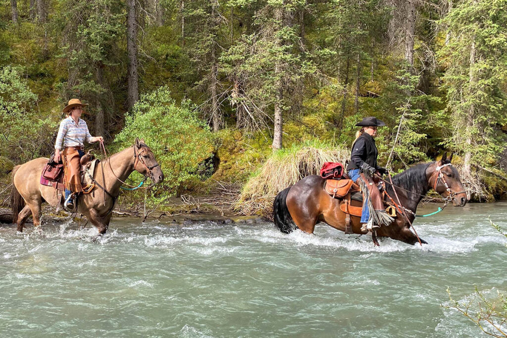 Riding into Sundance Lodge with Banff Trail Riders.